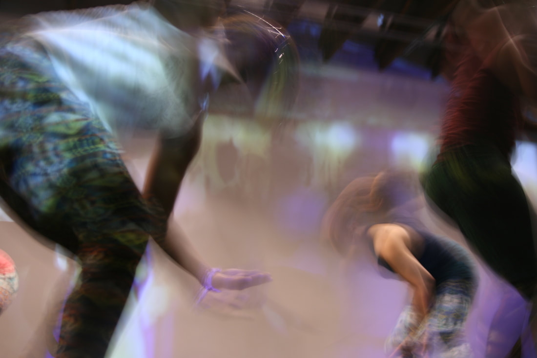 Intentionally blurred image of three women dancers. 
